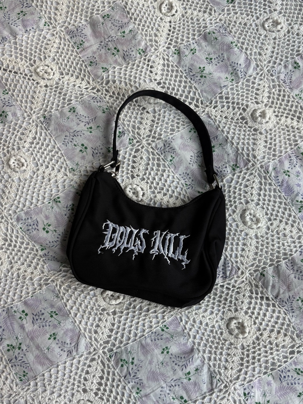 Dolls Kill Black mini nylon shoulder bag with white text embroidery